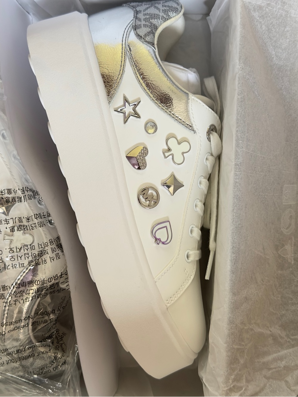 Michael Kors White Platform Sneaker with Metallic Gold Accents and Silver Charms